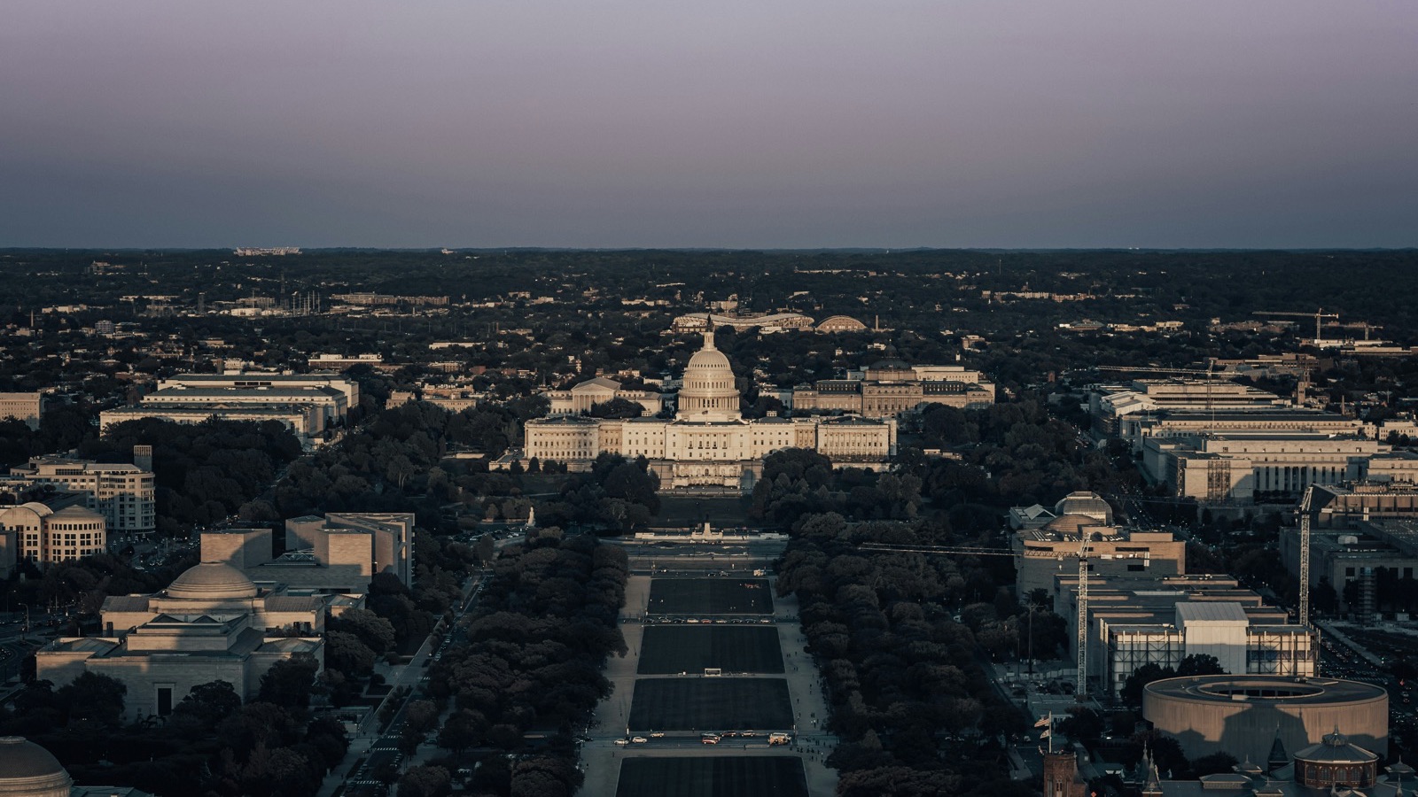 Aerial view of the Capitol and the National Mall at dusk